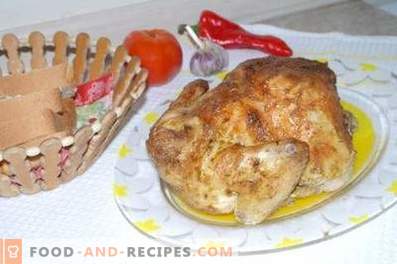 Chicken baked in foil in the oven entirely